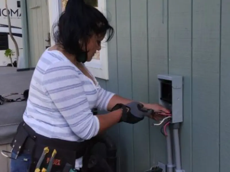 Licensed electrician wiring an exterior subpanel in Norridge