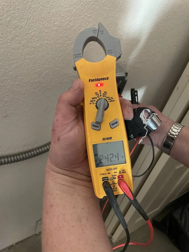 Voltage testing with clamp meter during Outlet Installation in Norridge